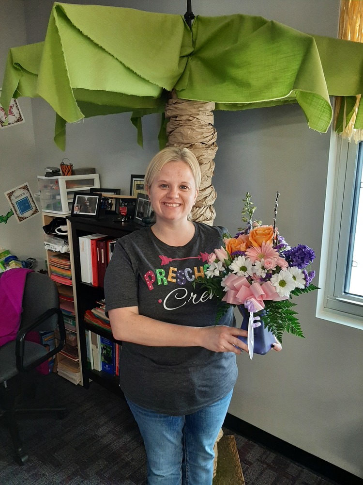 Mrs. Combs' with her flowers to celebrate Board Recognition!