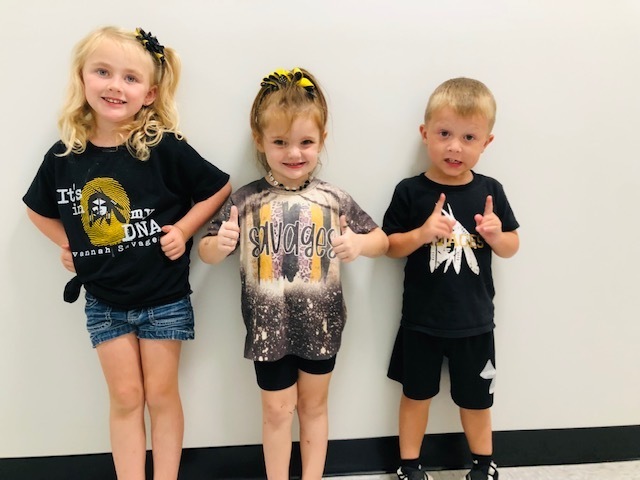 three students from the early learning center show off their savage pride