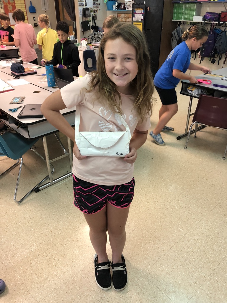 Student displays her hand made duct tape purse