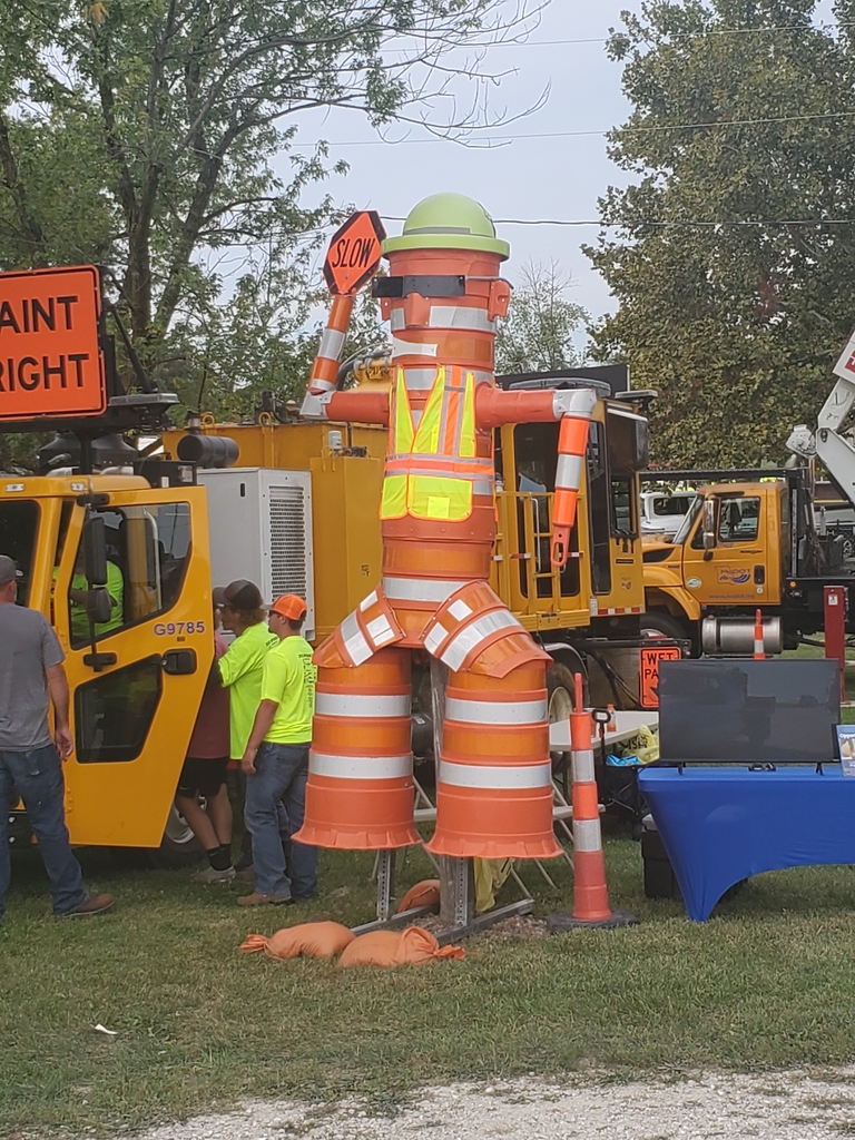 man made out of traffic cones and safety materials 